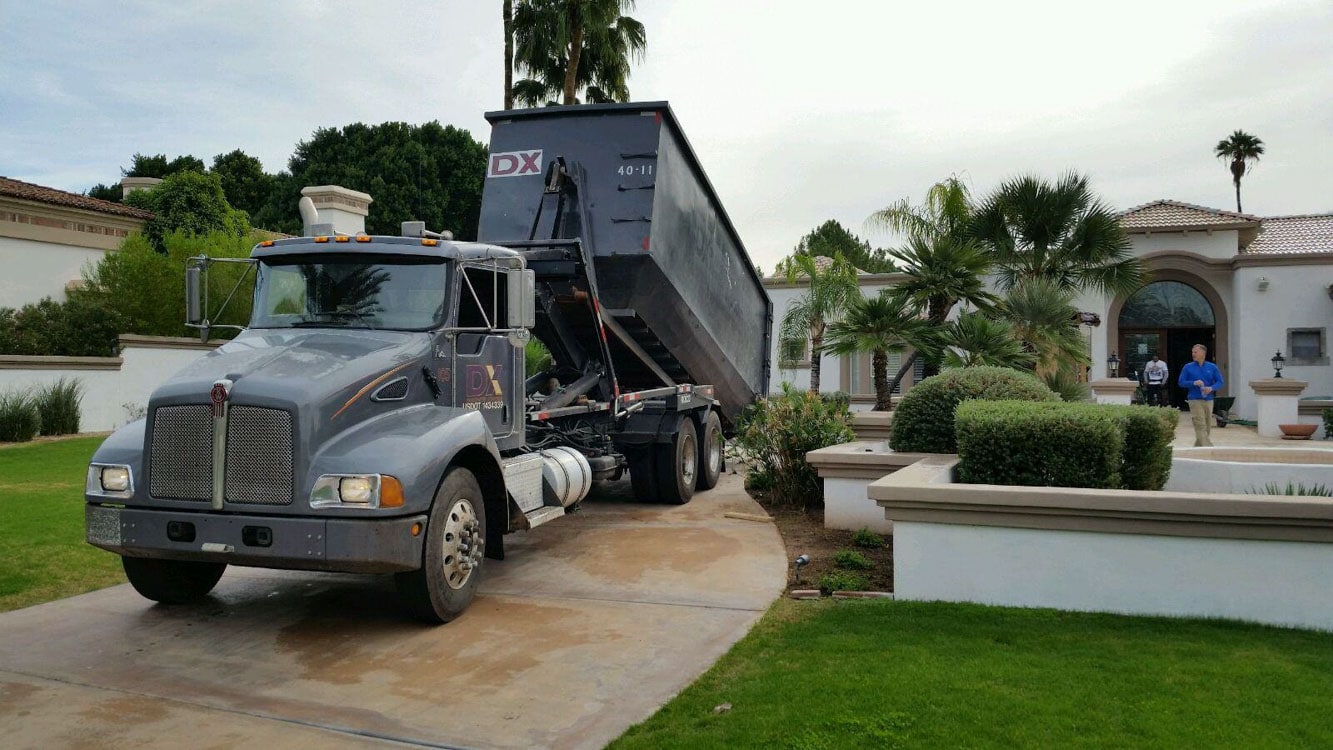 DX dumpster staged for a Tempe neighborhood project